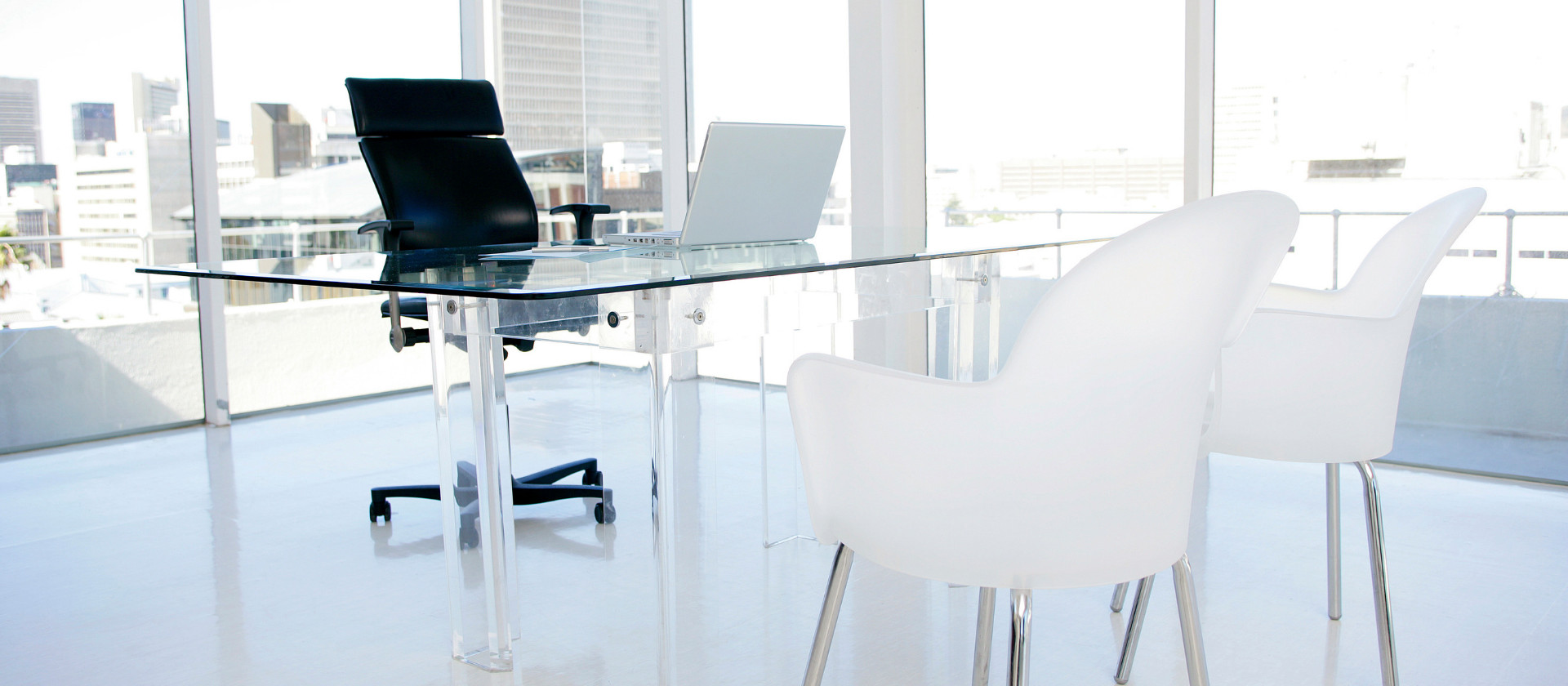 Three chairs, a computer and a desk